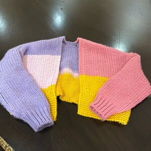 Knitted cardigan. Multicolor. size small. Tag removed because of itchiness.